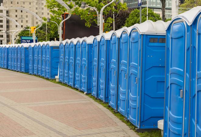 a line of brightly-colored portable restrooms, perfect for outdoor festivals and concerts in Brambleton VA